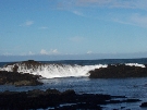 The sea looks so calm and yet produce such powerful waves crashing on the rocks